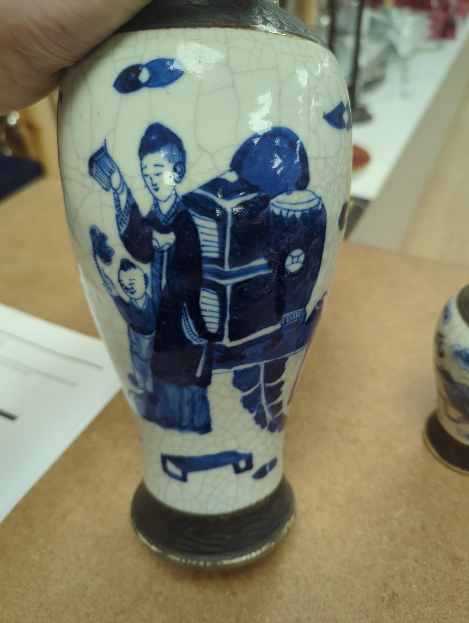 Three Chinese blue and white crackle glaze vases, a famille rose brush pot, late 19th/early 20th century, a crackle glaze ginger jar and a carved soapstone lion-dog (6)